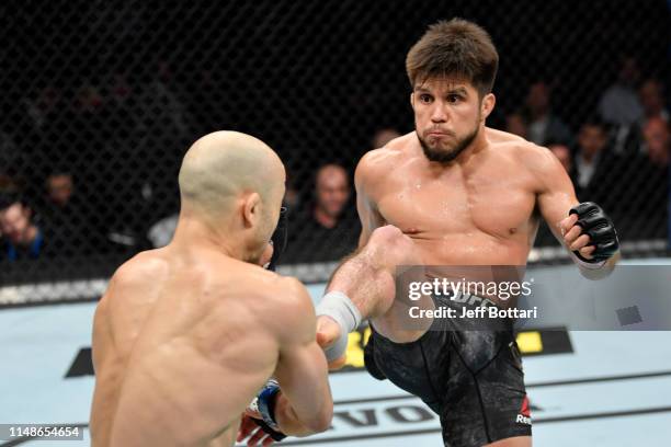 Henry Cejudo kicks Marlon Moraes of Brazil in their bantamweight championship bout during the UFC 238 event at the United Center on June 8, 2019 in...