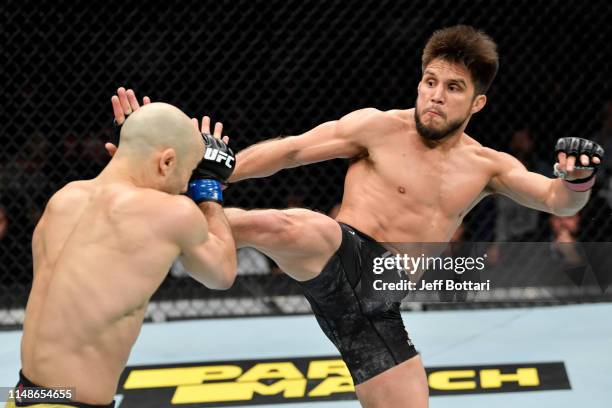 Henry Cejudo kicks Marlon Moraes of Brazil in their bantamweight championship bout during the UFC 238 event at the United Center on June 8, 2019 in...