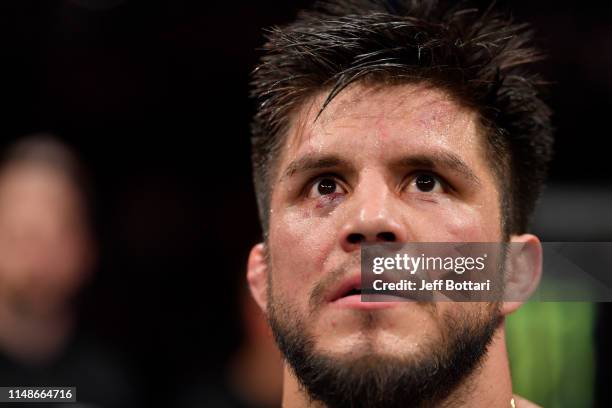 Henry Cejudo celebrates his TKO victory over Marlon Moraes of Brazil in their bantamweight championship bout during the UFC 238 event at the United...