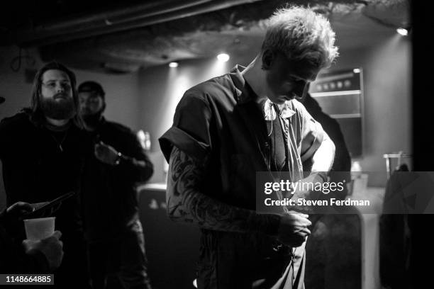 Machine Gun Kelly prepares backstage for a live performance at PlayStation Theater on June 8, 2019 in New York City.