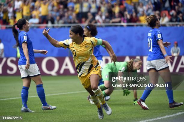 Australia's forward Samantha Kerr is congratulated by teammates after scoring a goal during the France 2019 Women's World Cup Group C football match...