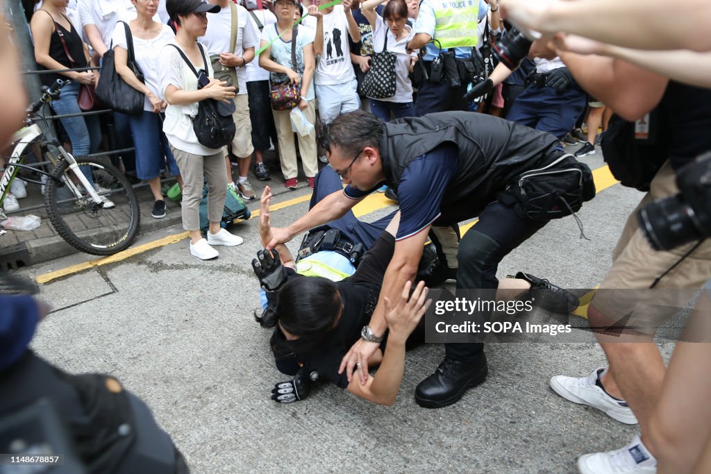 A demonstrator seen clashing with a police officer during...