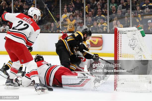 Jake DeBrusk of the Boston Bruins scores a first period goal against the Carolina Hurricanes in Game Two of the Eastern Conference Final during the...