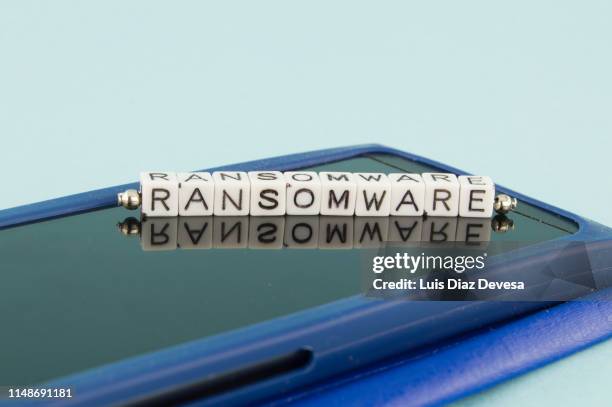 some people are using their mobile phones for making ransomware - global ransomware stockfoto's en -beelden