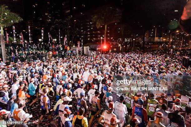 Runners take to the start of the 94th edition of the Comrades Marathon between Durban and Pietermaritzburg in Durban on June 09, 2019. The annual...