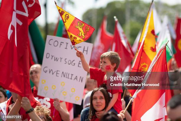 Child waves a flag as thousands take part in the first ever march for Welsh independence from City Hall to the Hayes on May 11, 2019 in Cardiff,...