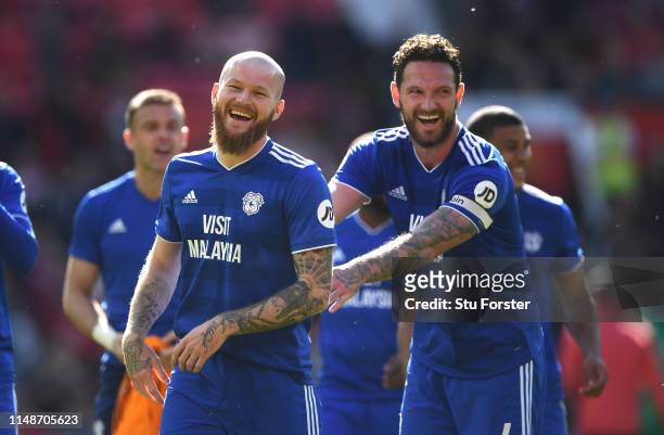 Cardiff player Aron Gunnarsson shares a joke with Sean Morrison after the Premier League match between Manchester United and Cardiff City at Old...
