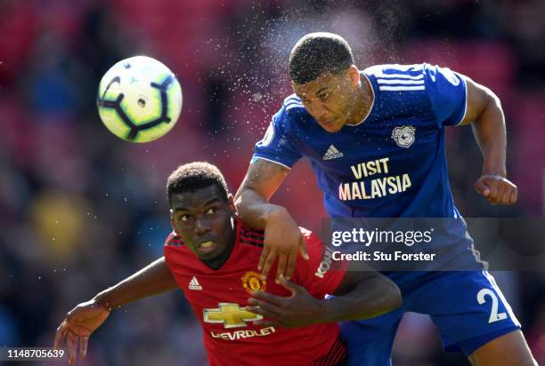 United player Paul Pogba is beaten to the ball by Cardiff player Lee Peltier during the Premier League match between Manchester United and Cardiff...
