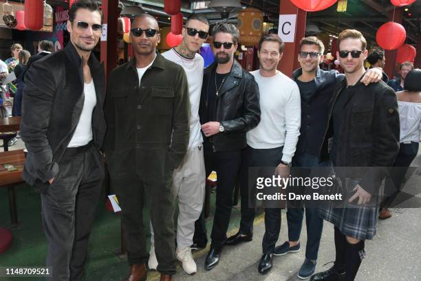 David Gandy, Eric Underwood, guest, Jack Guinness, Paul Sculfor, Johannes Huebl and Craig McGinlay attend the Oliver Spencer Menswear SS20 show...