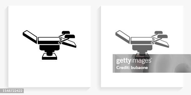 examination table black and white square icon - examination table stock illustrations