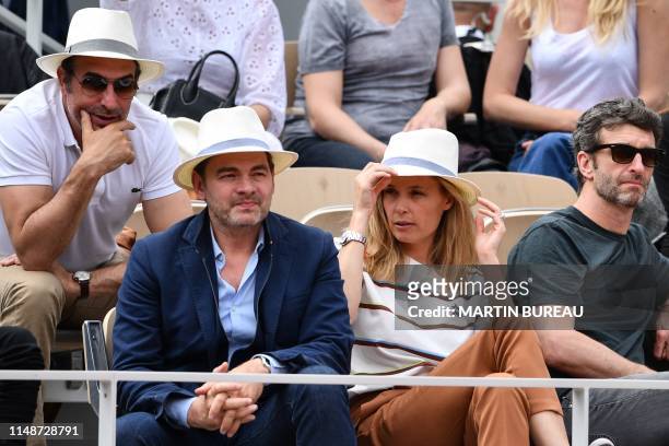 French actor Clovis Cornillac and French actress Lilou Fogli attend the men's singles final match between Spain's Rafael Nadal and Austria's Dominic...