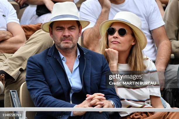 French actor Clovis Cornillac and French actress Lilou Fogli attend the men's singles final match between Spain's Rafael Nadal and Austria's Dominic...