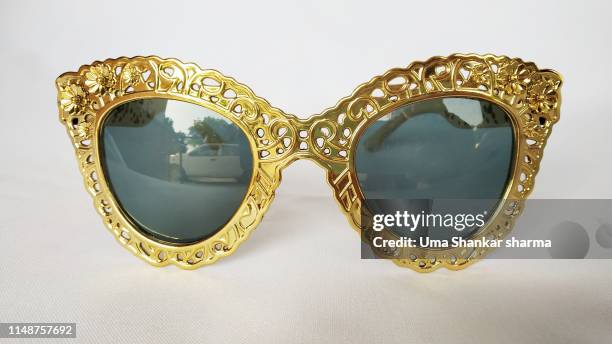 golden shades with embroidered frame - golden goggles 個照片及圖片檔