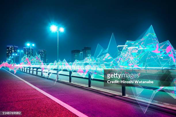 cityscape with abstract light trail at night - smart city concept stock-fotos und bilder