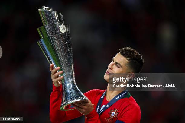 Cristiano Ronaldo of Portugal celebrates with the trophy during the UEFA Nations League Final between Portugal and the Netherlands at Estadio do...