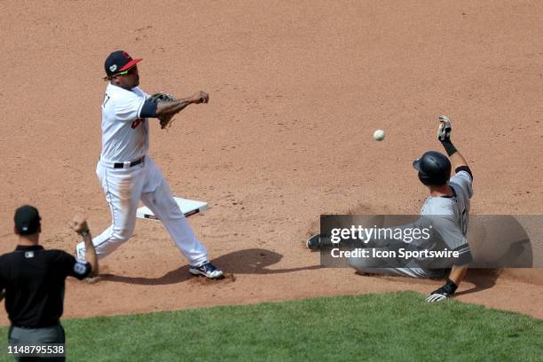 Cleveland Indians third baseman Jose Ramirez throws over a sliding New York Yankees infielder DJ LeMahieu to complete a double play during the sixth...
