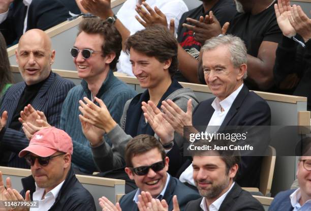 Founder Bernard Arnault and sons attend the men's final during day 15 of the 2019 French Open at Roland Garros stadium on June 9, 2019 in Paris,...