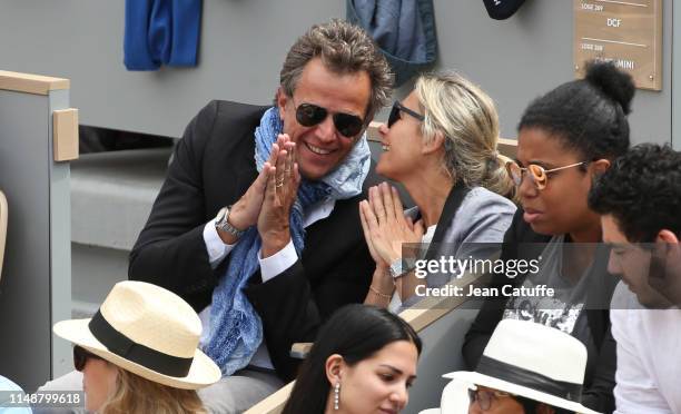 Anne-Sophie Lapix and husband Arthur Sadoun attend the men's final during day 15 of the 2019 French Open at Roland Garros stadium on June 9, 2019 in...