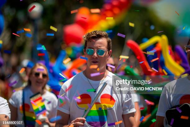 People from the Walt Disney Company participate in the annual LA Pride Parade in West Hollywood, California, on June 9, 2019. - LA Pride began on...