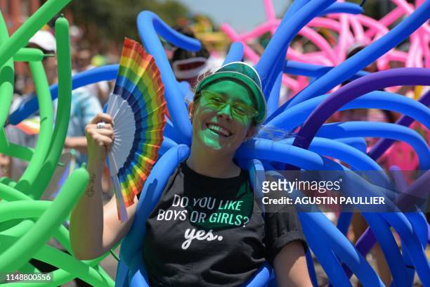 Woman participates in the annual LA Pride Parade in West Hollywood, California, on June 9, 2019. - LA Pride began on June 28 exactly one year after...