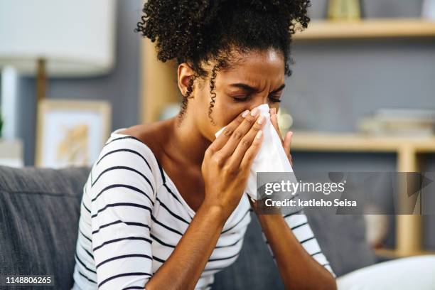 i'll have to stay in today - sick woman blowing nose stock pictures, royalty-free photos & images