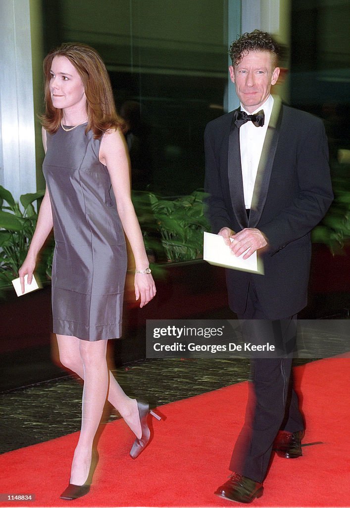 Singer Lyle Lovett and his wife April Kimble arrive for the 1998