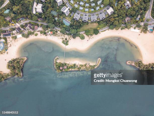 top view of tanjong beach at sentosa island in sentosa, singapore. sentosa is a popular island resort in singapore city. - sentosa island stock-fotos und bilder