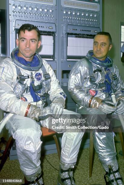 Astronauts John W Young and Virgil I Grissom during training exercises as the back-up crew for the Gemini VI mission, October 20, 1965. Image...