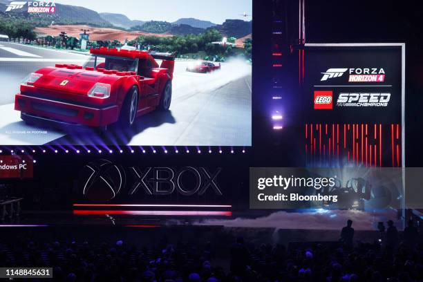 Full scale McLaren Senna made of LEGO bricks is unveiled, right, with the Forza Horizon 4 LEGO Speed Champions video game expansion during the...