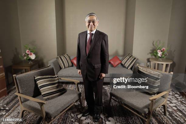 Haruhiko Kuroda, governor of the Bank of Japan , poses for a photograph following a Bloomberg Television interview in Fukuoka, Japan, on Monday, June...