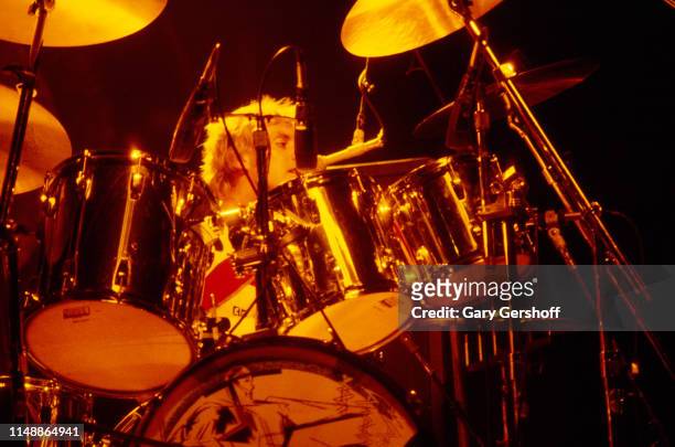 English Rock musician Roger Taylor, of the group Queen, plays drums as he performs onstage at Byrne Arena, East Rutherford, New Jersey, August 9,...
