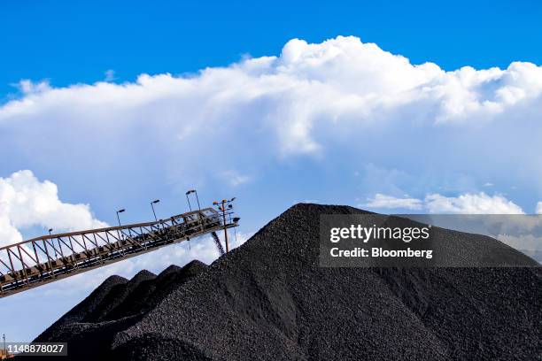 Manganese ore falls from a conveyor to a stockpile at the port in Port Hedland, Australia, on Monday, March 18, 2019. Port Hedland is the nexus of...