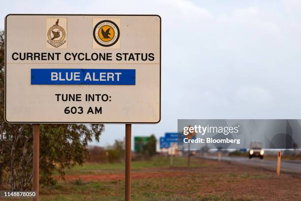 Sign showing the current cyclone status stands next to a highway in Port Hedland, Australia, on Thursday, March 21, 2019. Port Hedland is the nexus...
