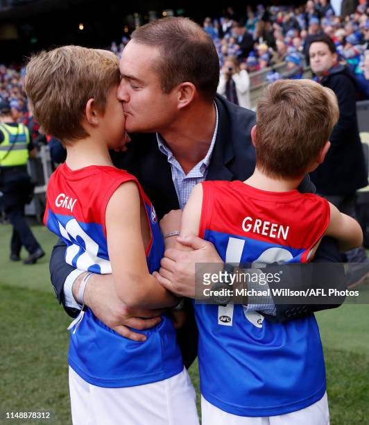 Brad Green with sons Oliver and Wilba during the 2019 AFL round 12 match between the Collingwood Magpies and the Melbourne Demons at the Melbourne...