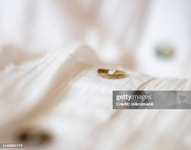 white fabric texture background with buttons. - white shirt texture stock pictures, royalty-free photos & images