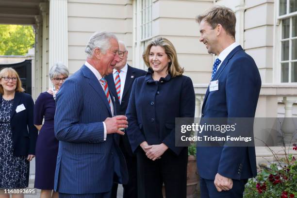 Prince Charles, Prince of Wales meets Secretary of State for Defence Penny Mordaunt and MP Tobias Ellwood during a reception by charity Combat Stress...