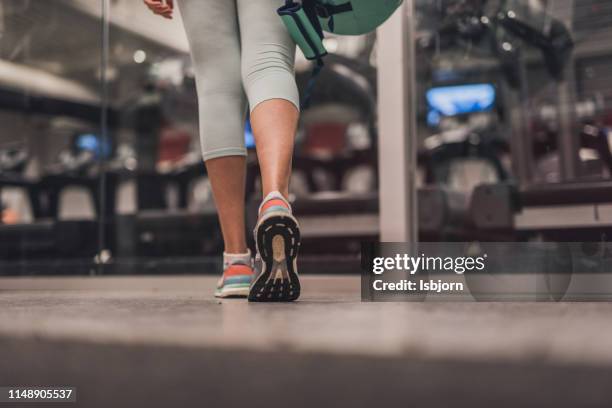 close up of walking in gym. - woman walking studio back stock pictures, royalty-free photos & images