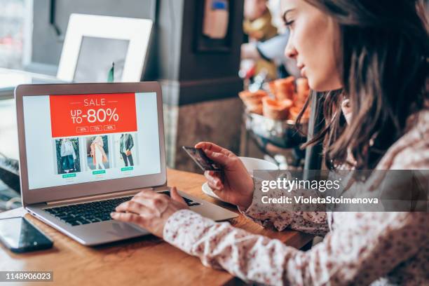 young woman shopping online - inexpensive stock pictures, royalty-free photos & images