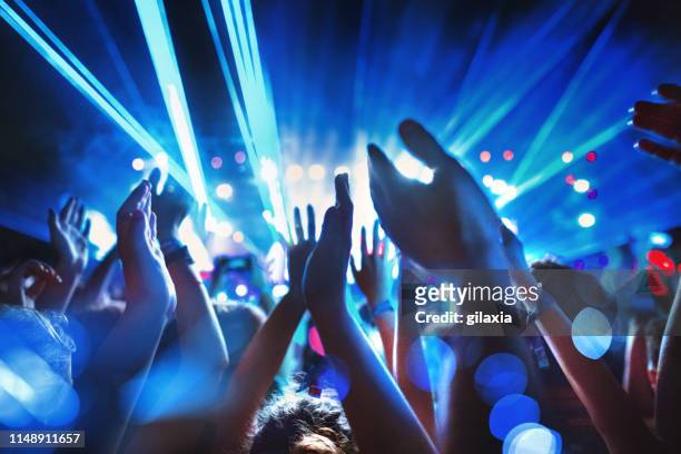 enjoying a concert. - light to night festival 2018 stock pictures, royalty-free photos & images