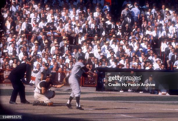Whitey Ford of the New York Yankees hits the sacrifice bunt during Game 6 of the 1960 World Series against the Pittsburgh Pirates on October 12, 1960...