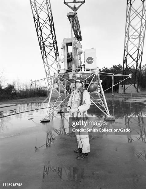 Neil Armstrong stands with equipment at the Lunar Landing Research Facility at the Langley Research Center in Hampton, Virginia, February 12, 1969....