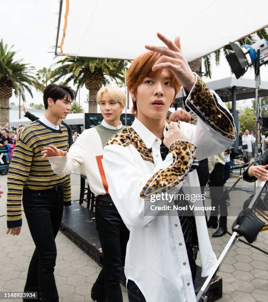 Johnny, Jungwoo and Yuta of NCT 127 visit "Extra"at Universal Studios Hollywood on May 13, 2019 in Universal City, California.