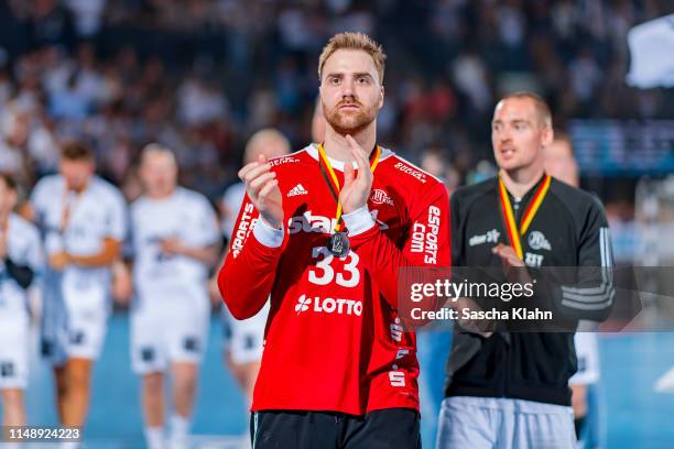 Goalkeeper Andreas Wolff of THW Kiel says farewell to the crowd during the DKB HBL match between THW Kiel and TSV Hannover-Burgdorf at Sparkassen...