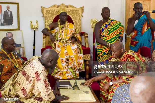 King Amon N'Douffou V , King of Krindjabo, capital of the Sanwi Kingdom, in the southeast of the Ivory Coast, attends an event with dignitaries,...