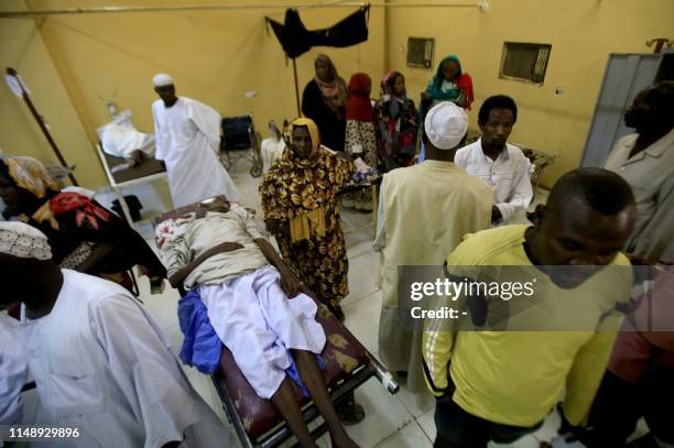 Patients in a hospital in Khartoum's twin city of Omdurman are shown on June 10, 2019 receiving treatment during a visit organised by Sudan's Health...