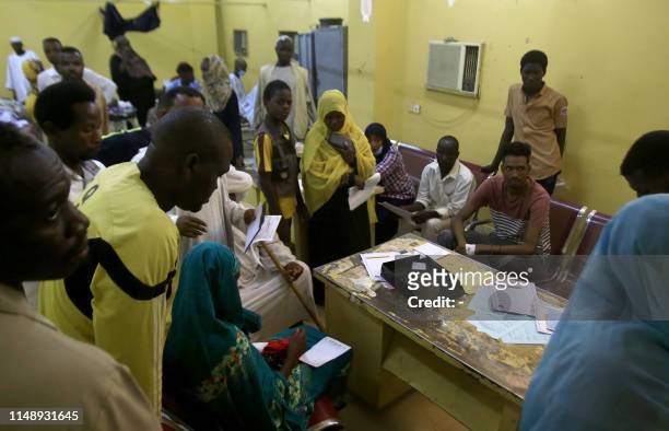 Patients in a hospital in Khartoum's twin city of Omdurman are shown on June 10, 2019 receiving treatment during a visit organised by Sudan's Health...