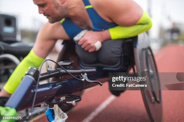 adaptive athlete training on his racing wheelchair - wheelchair race stock pictures, royalty-free photos & images