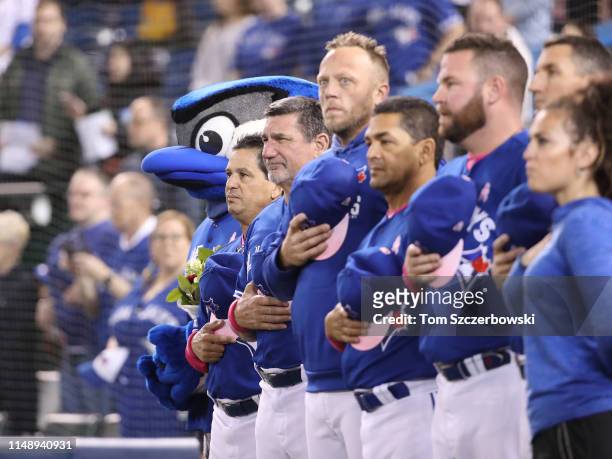 Manager Charlie Montoyo of the Toronto Blue Jays and mascot Ace and bench coach Dave Hudgens and Major League field coordinator Shelley Duncan and...