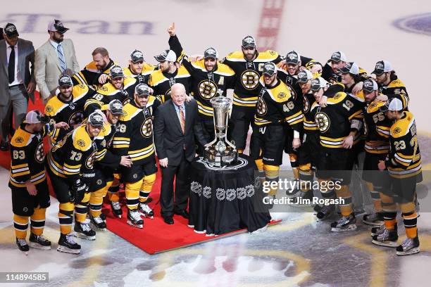 The Prince of Wales trophy is presented to the Boston Bruins by Deputy Commissioner Bill Daly after they defeated the Tampa Bay Lightning 1 to 0 in...