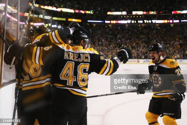 Nathan Horton of the Boston Bruins celebrates his third period goal with teammates in Game Seven of the Eastern Conference Finals against the Tampa...